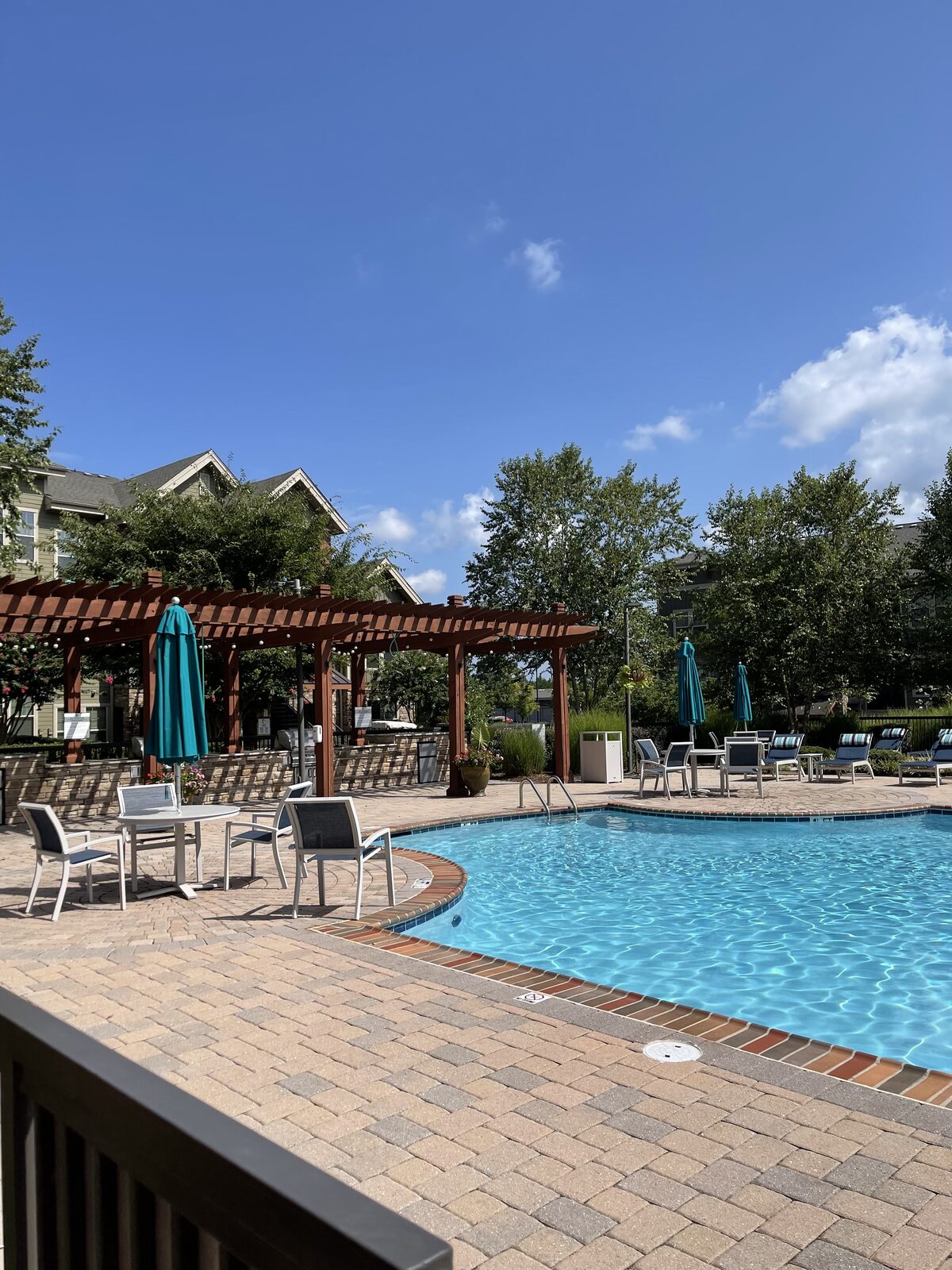 Outdoor pool and gathering space at a Convivium community